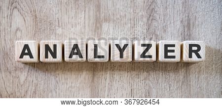 Analizer - Text On Small Wooden Cubes On A Natural Table