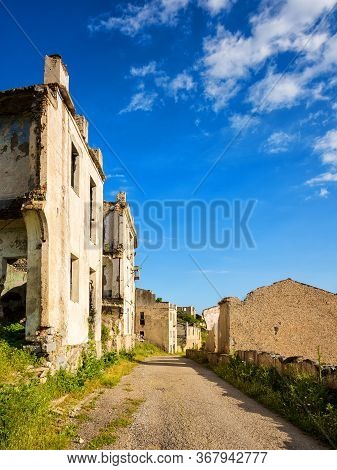 Ruined Buildings Of An Abandoned City. Architecture Of A Ghost Town.