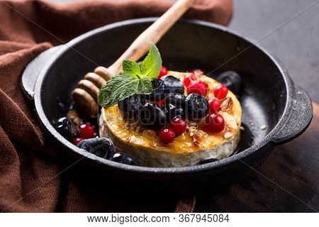 Baked Or Fried Camembert Or Brie Cheese With Berry And Honey. Gourmet Breakfast. Selective Focus Bak
