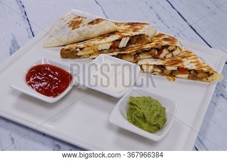 Mexican Chicken Quesadilla Sandwiches And Typical Condiments