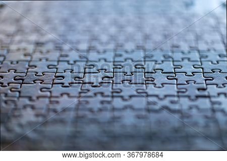 Several Puzzle Pieces Put Together Symbolizing Success And Completion Of A Project