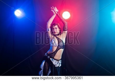 Girl Dancing Belly Dance, Fusion Or Tribal. A Woman In A Beautiful Costume Demonstrates Charming And