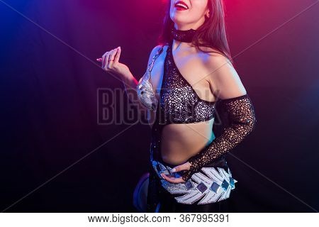 Close-up Of Girl Dancing Belly Dance, Fusion Or Tribal. A Woman In A Beautiful Costume Demonstrates 