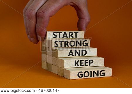 Start Strong And Keep Going Symbol. Concept Words 'start Strong And Keep Going' On Wooden Blocks On 