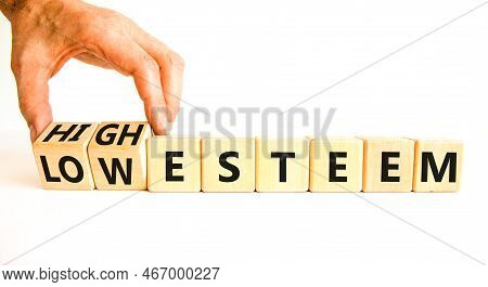 High Or Low Esteem Symbol. Concept Words High Esteem And Low Esteem On Wooden Cubes. Businessman Han