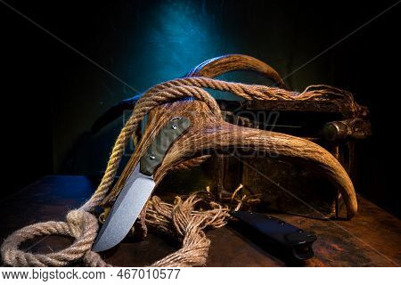 Hunting Knife And Elk Horn. Hunting Composition With A Knife And A Horn. Hunter's Hut. Hand Tools. I