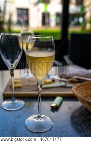 Tasting Of White Brut Sparkling Champagne Wine Outdoor In Cafe In Reims, Champagne, France