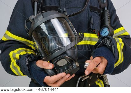 Full Protective Breathing Air Mask In Hand Of Unrecognized African-american Firefighter, Rescue And 
