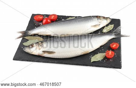 Slate Plate With Salted Herrings, Bay Leaves, Cherry Tomatoes And Spices Isolated On White