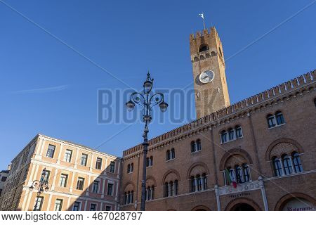 Watch Tower In The City Center Of Treviso, Italy. Beautiful Piazza Dei Signori Is The Palazzo Dei Tr