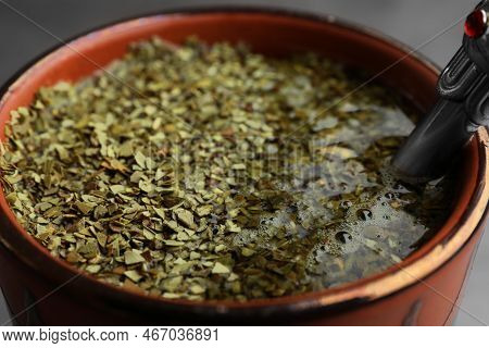 Guampa With Bombilla And Mate Tea On Grey Background, Closeup