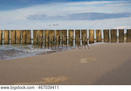 Breakwater On The Beach Of The Baltic Sea Near Rewal. Poland