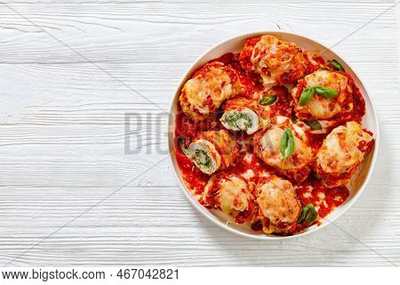 Chicken Rollatini With Spinach Ricotta Filling In Marinara Sauce Topped With Mozzarella Cheese And F