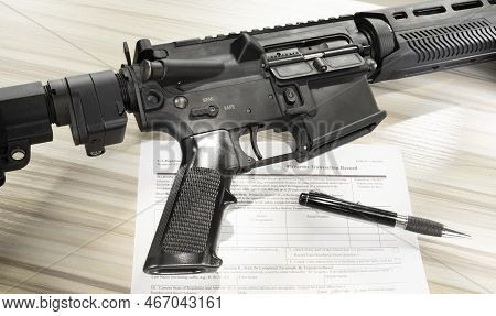 Ar-15 And Public Domain Fbi Nics Check Form With A Pen