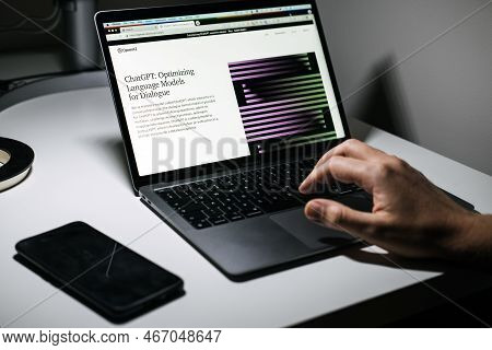Screen With Chatgpt Chat With Ai Or Artificial Intelligence. Man Search For Information Using Artifi