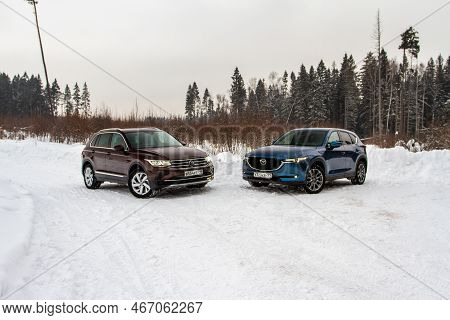 Moscow, Russia - January 22, 2022. Volkswagen Tiguan (ad1) 4motion, And Mazda Cx5 (kf) Skyactive, Su