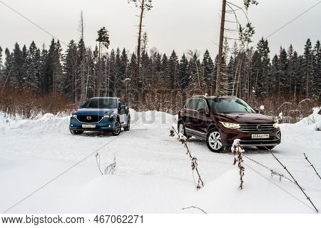Moscow, Russia - January 22, 2022. Volkswagen Tiguan (ad1) 4motion, And Mazda Cx5 (kf) Skyactive, Su