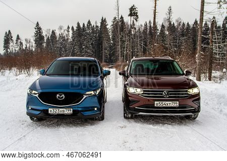 Moscow, Russia - January 22, 2022. Volkswagen Tiguan (ad1) 4motion, And Mazda Cx5 (kf) Skyactive, Su