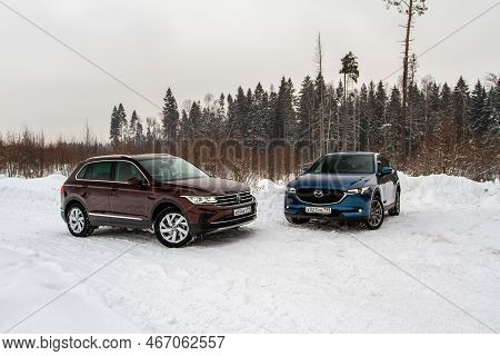 Moscow, Russia - January 22, 2022. Volkswagen Tiguan (ad1) 4motion, And Mazda Cx5 (kf) Skyactive, Su