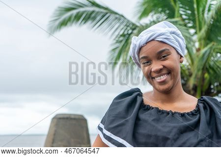 Portrait Of A Nicaraguan Caribbean Afro-descendant Woman Smiling And Looking At Camera With Copy Spa