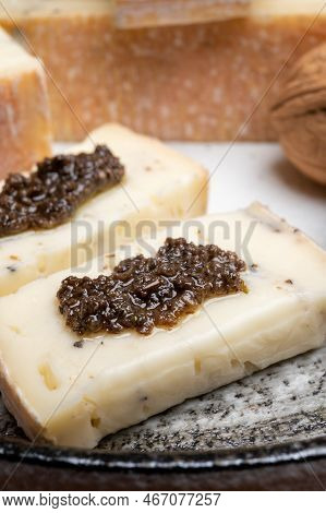 Italian Cheese Collection, Yellow Taleggio Cheese With Black Truffles Mushrooms