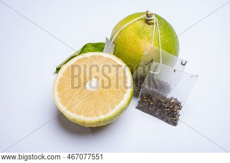 Fresh Ripe Bergamot Orange Fruits And Tea Bags, Fragrant Citrus Used In Earl Grey Tea, Medicine And
