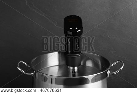 Sous Vide Cooking. Thermal Immersion Circulator In Pot On Dark Grey Background