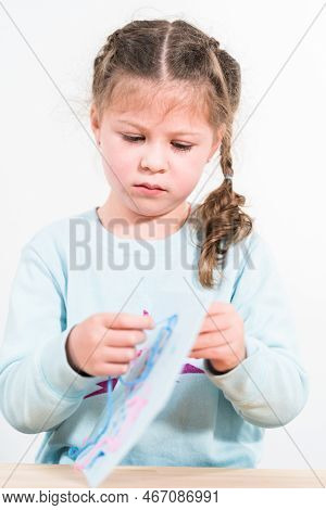 Little Girl Learning How To Sew With Sewing Craft Kit For Kids.