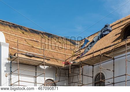 Elim, South Africa - Sep 21, 2022: Re-thatching Of The Roof Of The Historic Moravian Church In Elim 