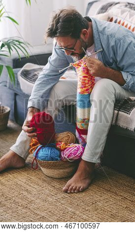 One Mature Man Alone At Home Spending Time In Knitting Work As Indoors Leisure Activity. Hobby For M
