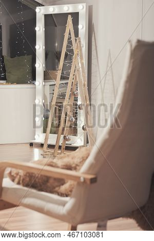 Cozy Winter Decor For Holiday. Comfortable Apartment With Wooden Chrstmas Trees And Illuminated Mirr