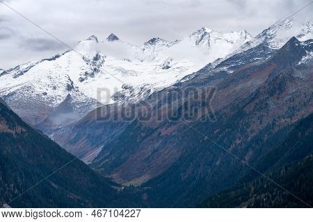 Gabler, Reichenspitze And Hahnenkamm Peaks Covered In Snow And Ice On A Cloudy, Rainy Day Of Autumn.