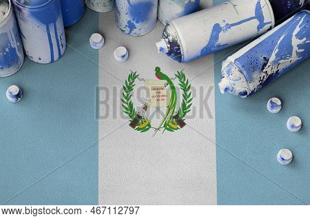 Guatemala Flag And Few Used Aerosol Spray Cans For Graffiti Painting. Street Art Culture Concept, Va
