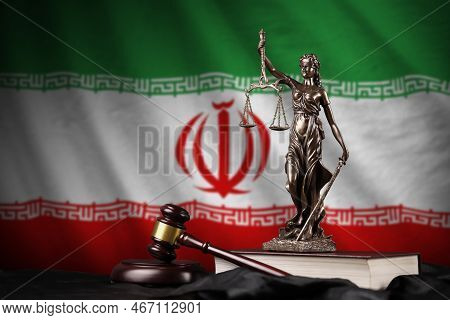 Iran Flag With Statue Of Lady Justice, Constitution And Judge Hammer On Black Drapery. Concept Of Ju