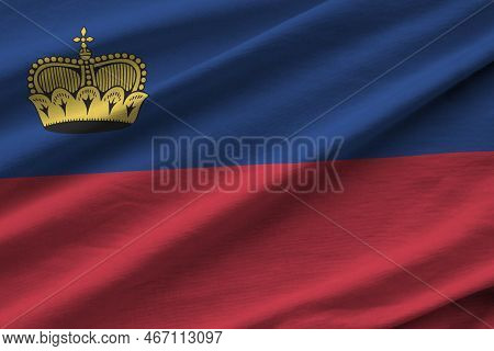 Liechtenstein Flag With Big Folds Waving Close Up Under The Studio Light Indoors. The Official Symbo