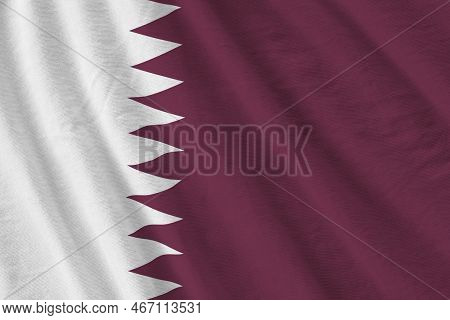 Qatar Flag With Big Folds Waving Close Up Under The Studio Light Indoors. The Official Symbols And C