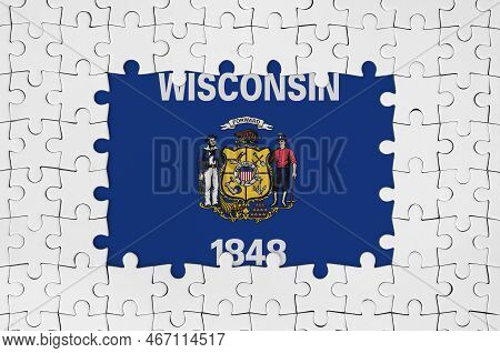 Wisconsin Us State Flag In Frame Of White Puzzle Pieces With Missing Central Parts