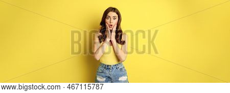 Portrait Of Brunette Woman Reacting Surprised To Advertsement, Gasping And Saying Wow, Wearing Summe
