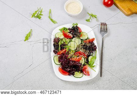 Healthy Vegetable Salad With Fresh Salad Leaves, Arugula, Cherry Tomato, Cucomber And Parsley In Pla