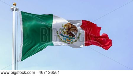 Mexican National Flag Waving In The Wind. Mexico Is A Country In The Southern Portion Of North Ameri