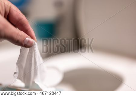 Disposable Wipes Being Flushed Down A Toilet Where They Can Cause Clogging And Problems With Wastewa