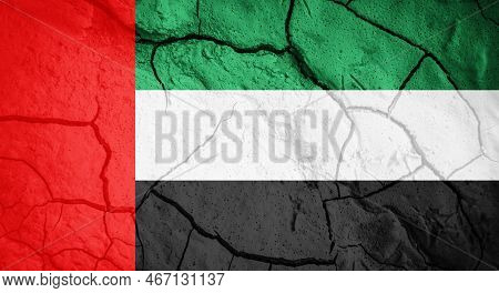 Flag Of United Arab Emirates. United Arab Emirates Symbol. Flag On The Background Of Dry Cracked Ear