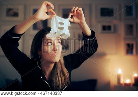 Funny Woman Taking Off Her Vitamin C Sheet Facial Mask