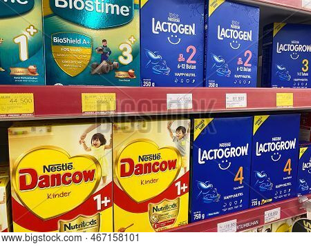 Makassar - Indonesia, 2022-12-13. Baby Formula Milk Is Displayed In A Shop Window Or Supermarket