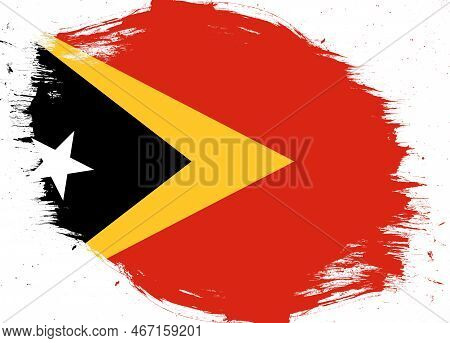 East Timor Flag On Distressed Grunge Brush Background