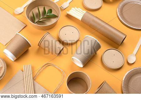 Eco-friendly Paper Utensils And Paper Food Packaging Articles Over Orange Background. Street Food Pa