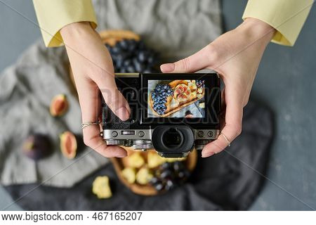 High Anlge View Of Photographer Making Photo Of Fresh Fruits On Wooden Board Using Her Professional 