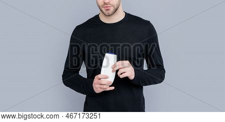 Cropped View Of Man With Unbranded Cosmetic In Studio. Unbranded Cosmetic For Man.