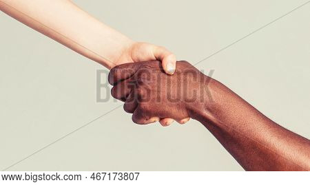 Woman And African Woman Hand. Helping Hand, Rescue, Multiathnic People. Helping Hands, Rescue Gestur