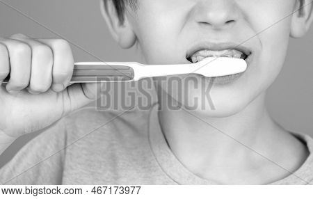 Little Boy Cleaning Teeth. Dental Hygiene. Happy Little Kid Brushing Her Teeth. Black And White